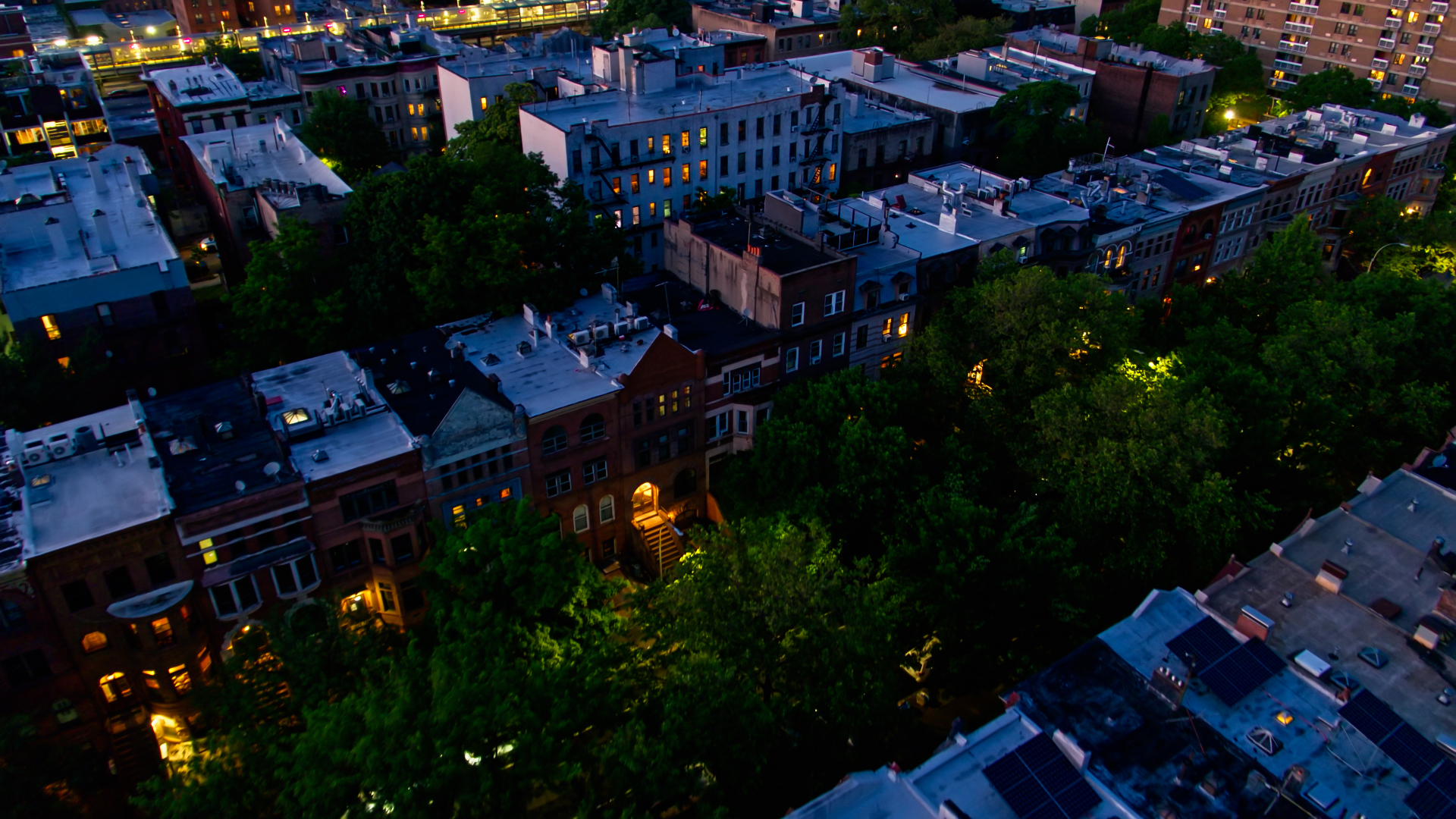 Nighttime aerial view of Brooklyn and Queens multifamily buildings